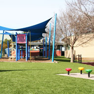 Synthetic grass for playgrounds