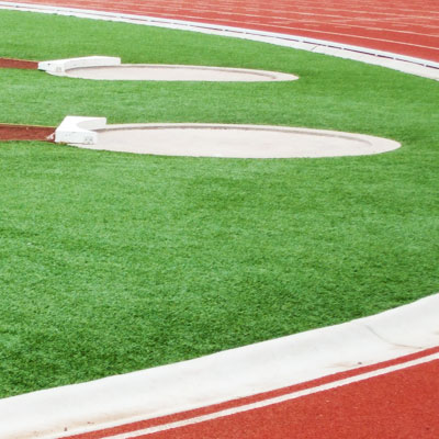 Synthetic grass for track and field